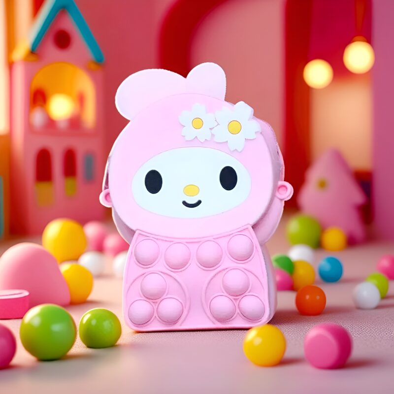An Adorable Small Pop It Sling Bag shaped like My Melody in pink, with pop it bubbles on its body, surrounded by colorful small balls in a pink room setting.