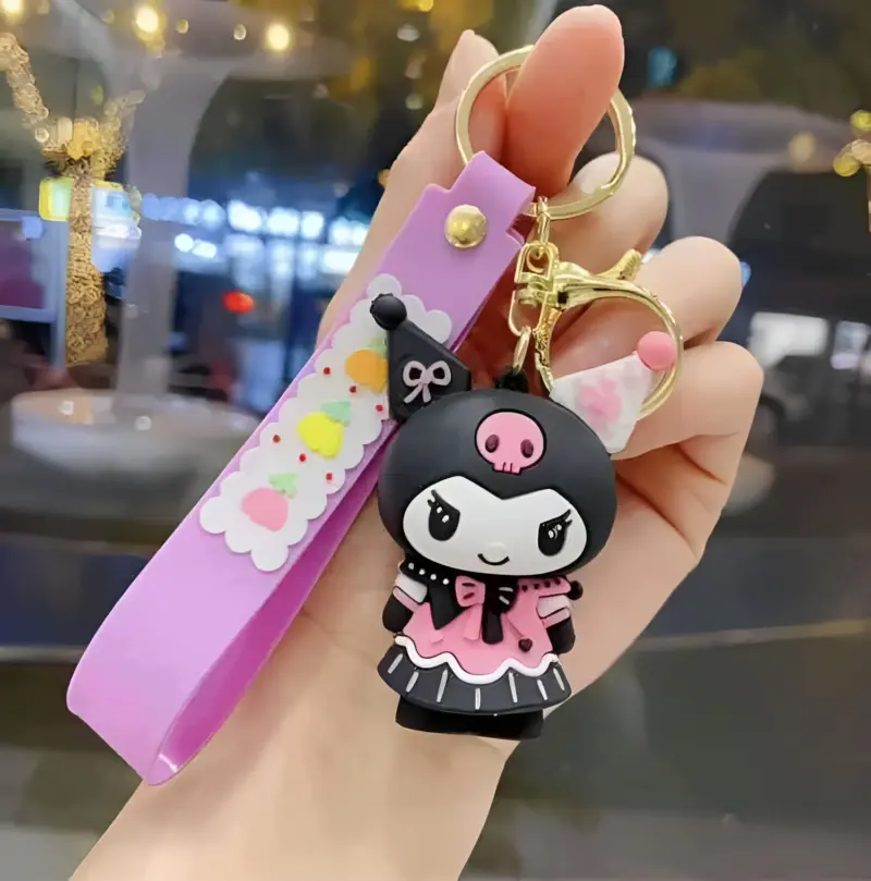 A Kuromi Keychain featuring the black and pink Sanrio character with a skull and bow on her head, attached to a metal key ring.