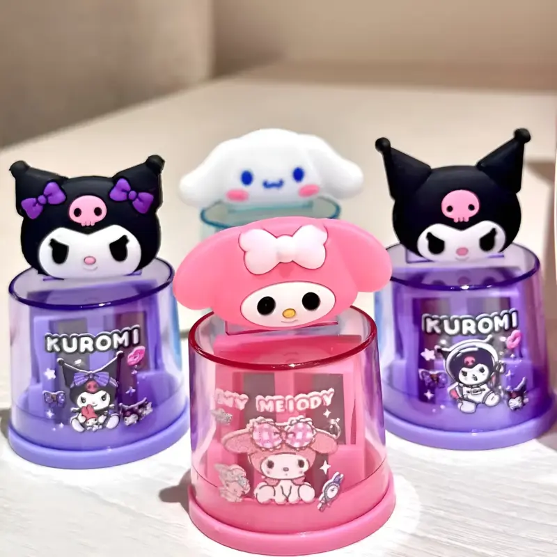 A close-up of a pink Sanrio Pencil Sharpener with a Hello Kitty or My Melody design and a transparent shavings collector.